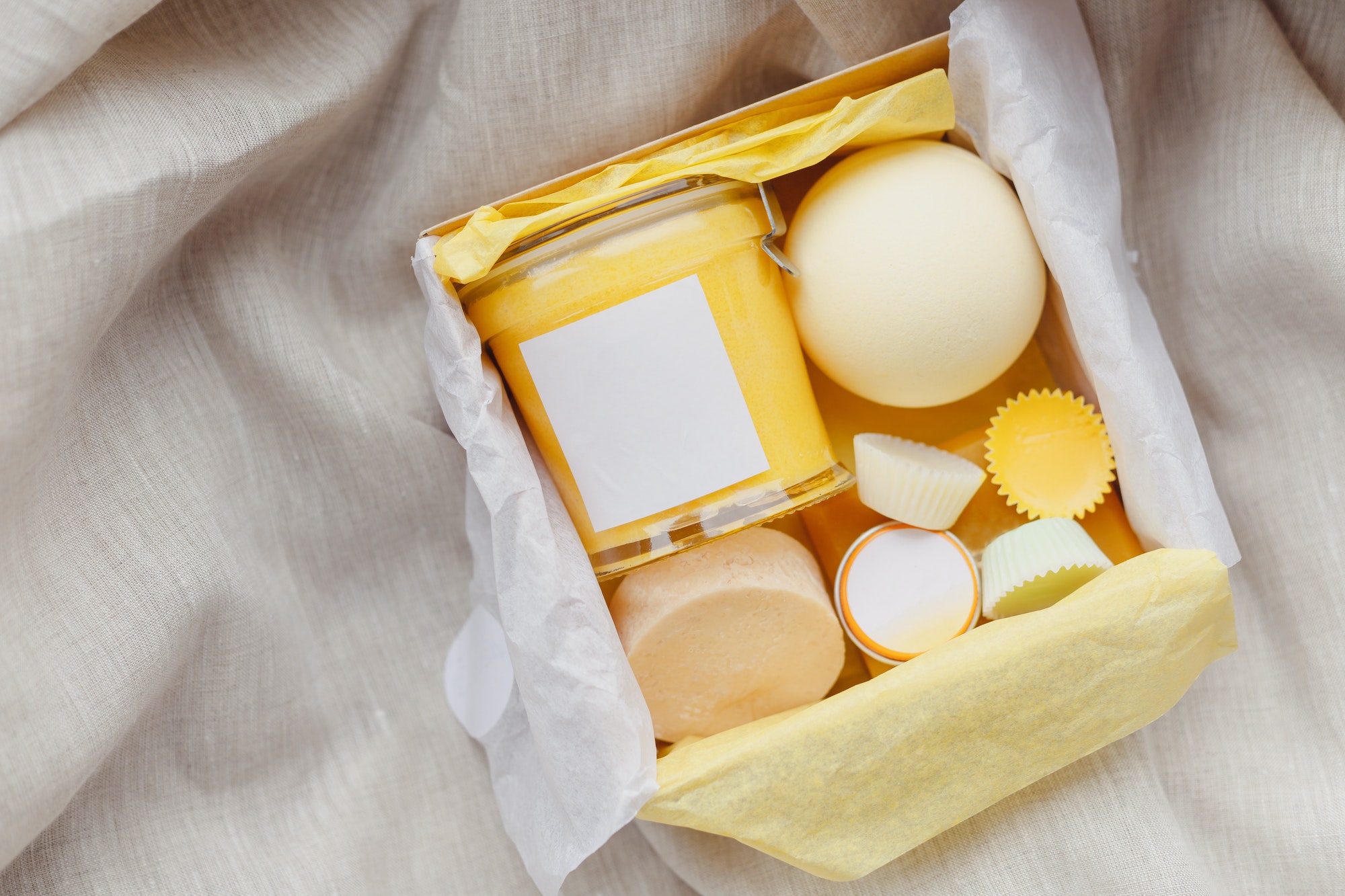 Natural cosmetics set in gift box. Body cream, essential oils, handmade soap